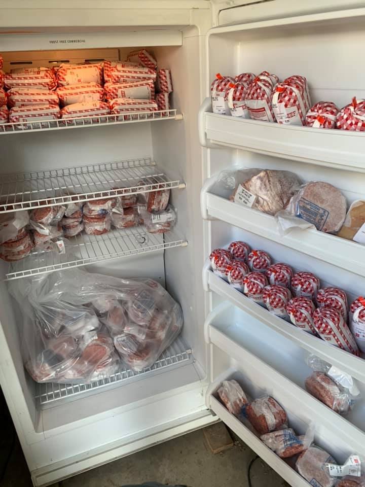178072070_1356640128044484_4972732373079098280_n A well-stocked freezer filled with various types of packaged meats, including ground beef, sausages, and steaks, organized on shelves for easy access.